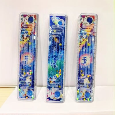 Space themed liquid ruler with maze game and flowing glitter