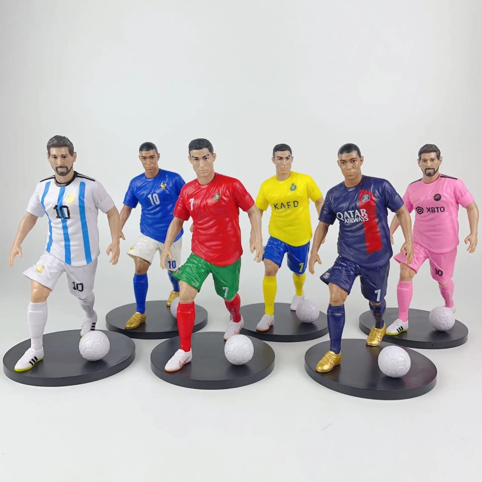 Football star figurines featuring Ronaldo, Mbappé and Messi