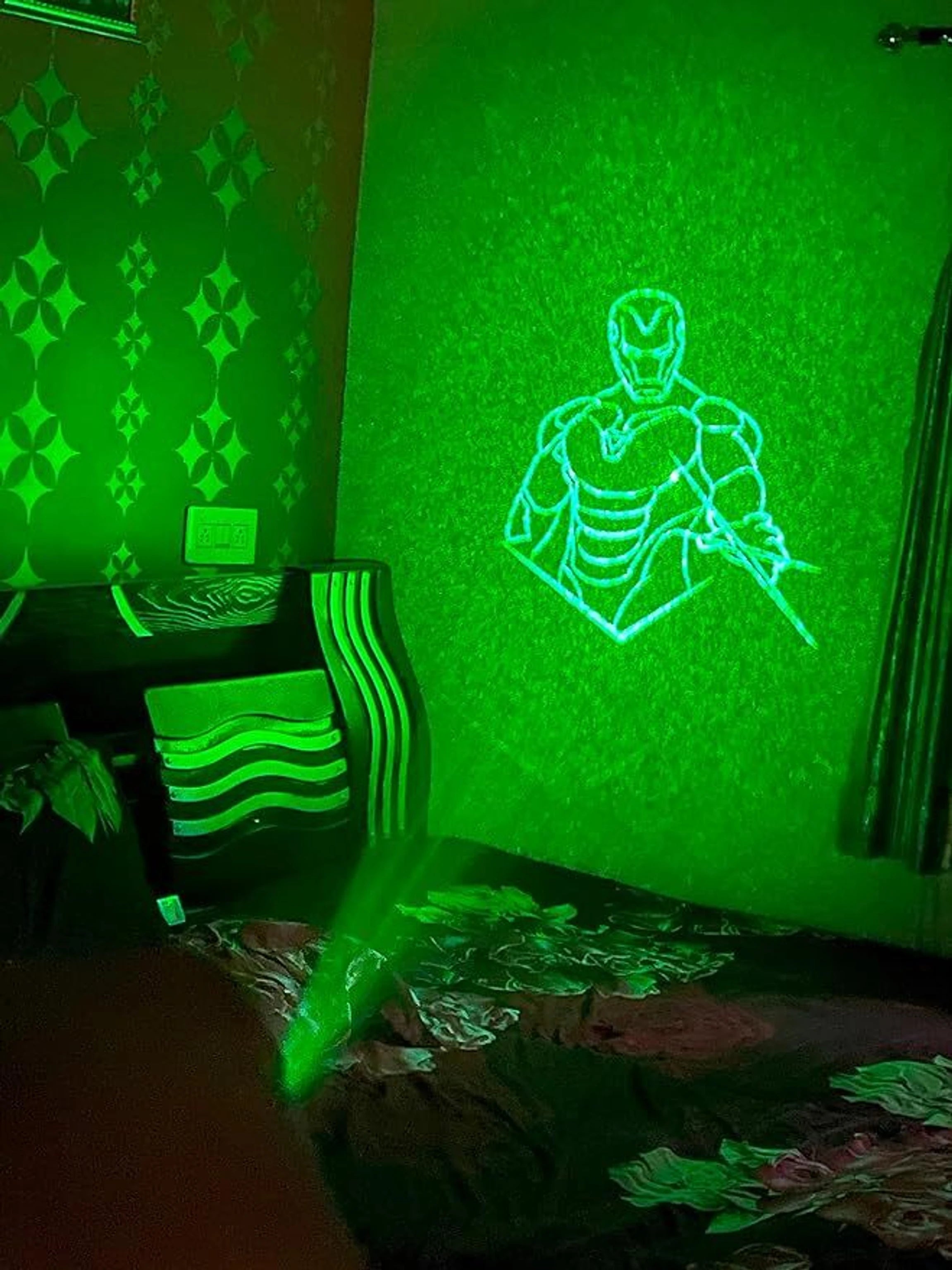 Superhero Laser Projection Night Light projecting on wall